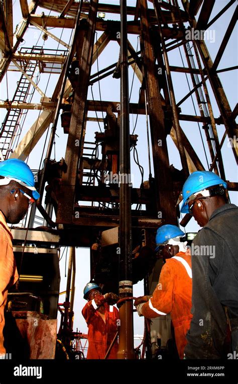 Thematic photo of a driller operating a drilling rig, possibly in an urban or construction setting