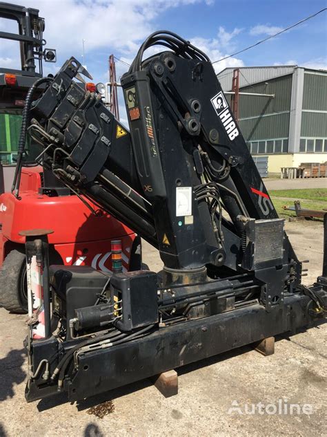 The HIAB XS 166 HDS loader crane mounted on a truck, with its boom extended during operation.
