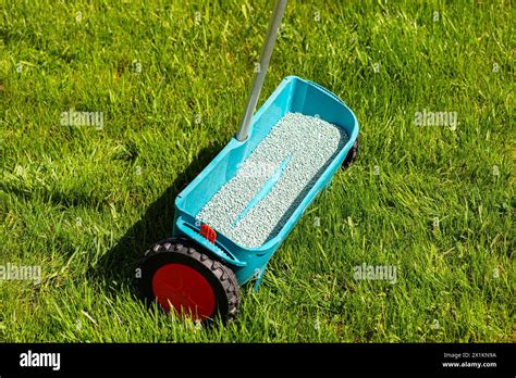 Thematic photo: person using a lawn seeder