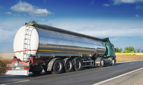 Thematic photo of a grain-carrying tanker truck on a field road