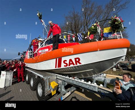 Red DGzRS sea rescue boat on its trailer, ready for deployment