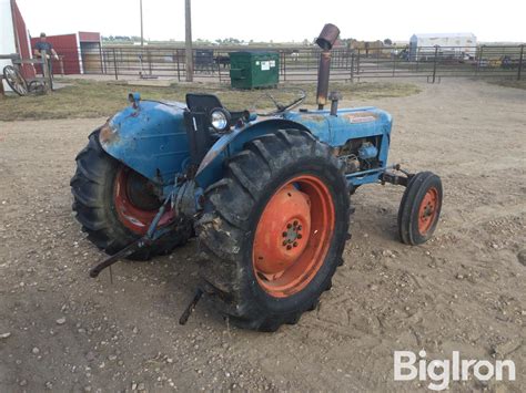 Thematic photo of an old Ford Dexta tractor on a field