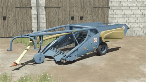 The Agromet Pionier S222/1 potato planter in operation, showing its vibrating tables and operator platform