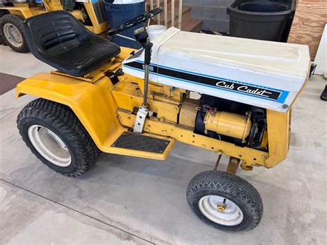 Photo of various MTD and Cub Cadet spare parts (cables, covers)