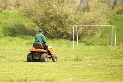 Thematic photo of a care mower working in a park or on a sports field