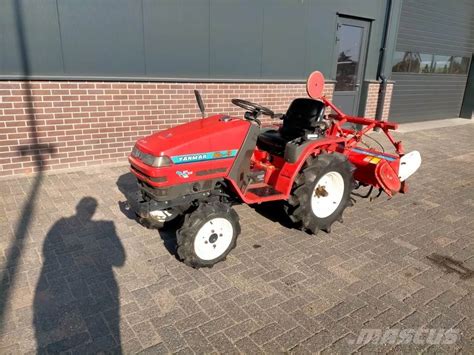 Thematic photo of a Yanmar mini tractor working in a field