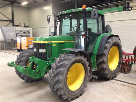 Thematic photo of John Deere 6310 tractor working in a field