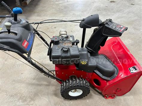 Thematic photo of Toro Power Max 826 snowblower clearing snow