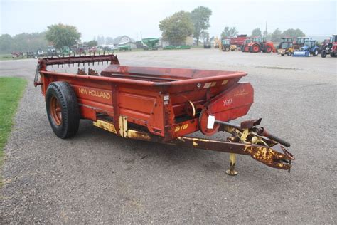 Thematic photo of a single-axle manure spreader in operation