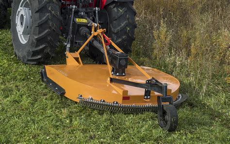 Thematic photo of a drum rotary mower working in a field