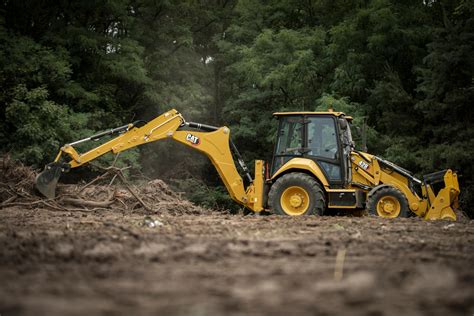 Thematic photo of a Cat 428B backhoe loader at work