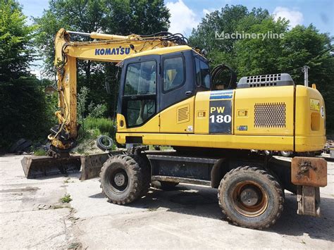 Thematic photo of Komatsu PW180-7E0 working on a construction site