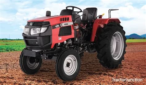 The VST Shakti 932 DI tractor working in a field, highlighting its 4x4 capability and compact size.