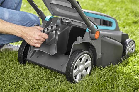 Thematic photo of a Gardena electric lawnmower working in a garden