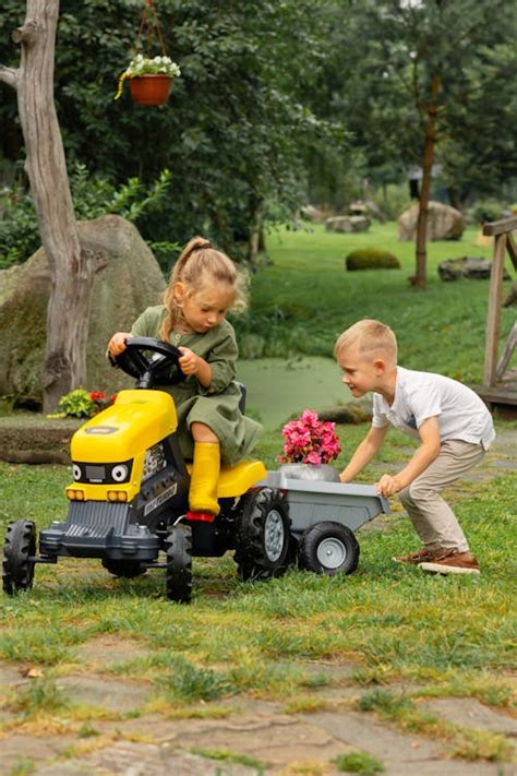 Thematic photo of a child playing with a Dumel tractor toy