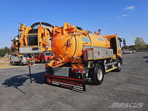 Thematic photo of a large WUKO vehicle cleaning a street drain