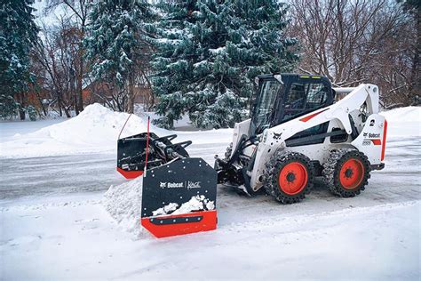Thematic photo of various Bobcat snow removal attachments laid out