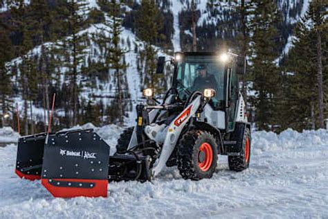 Thematic photo of Bobcat L85 loader with a snow plow attachment