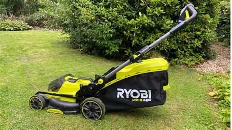 Thematic photo of a Ryobi cordless lawn mower in a well-maintained garden, highlighting its quiet operation.