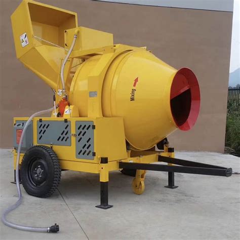 A child playing intently with a remote-controlled concrete mixer in a garden