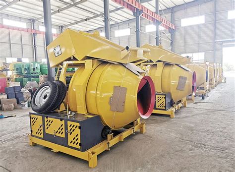 Photo of a professional drum concrete mixer on a construction site
