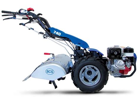 The BCS 740 PowerSafe two-wheel tractor with a separating rototiller attachment in action, preparing soil.