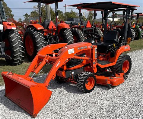 Kubota mini tractor working in a greenhouse