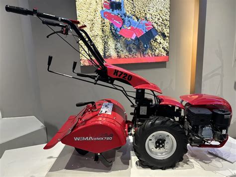 Thematic photo of a person operating a Weima tiller in a garden