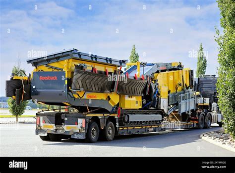 Thematic photo of a corn planter being transported on a low-loader trailer