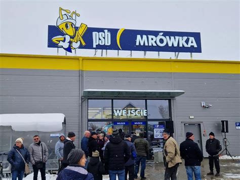 Zdjęcie przedstawiające fasadę sklepu PSB Mrówka lub logo firmy Cyroń