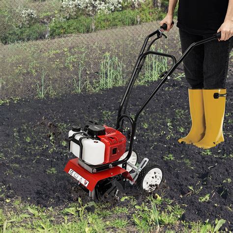 Thematic photo of Oleo-Mac rototillers in use in a garden