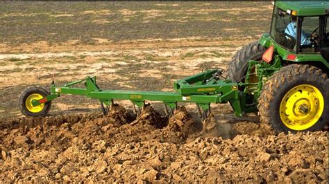 Thematic photo of a reversible plow in operation on a field