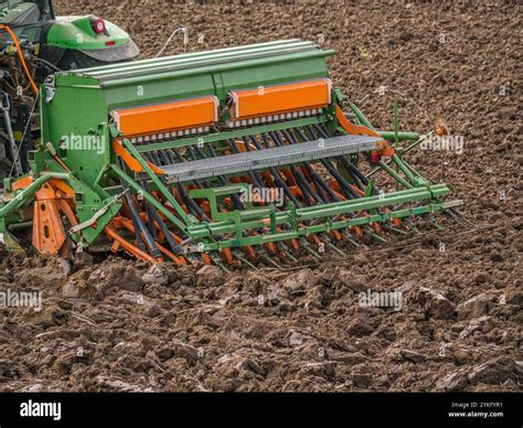 Thematic photo of a modern cultivator-hiller working in a field