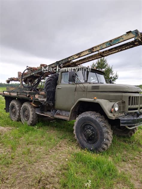A ZIL-131 truck with a drilling rig attachment, ready for work