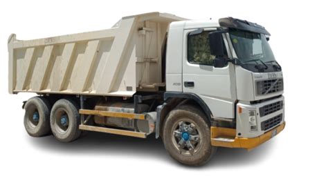 Thematic photo of a dump truck or tipper truck working on a construction site in Małopolska, possibly with mountains in the background.