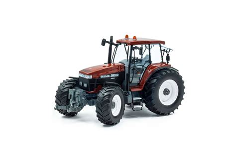 Zabawkowa odśnieżarka New Holland przymocowana do traktora