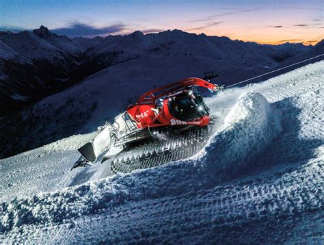 The PistenBully 600 series snow groomer working on a slope