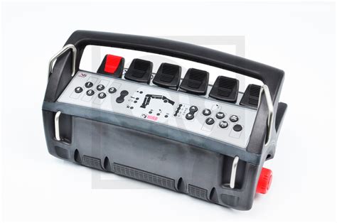 Photo of Hiab radio remote control kit components: transmitter, receiver, charger, battery