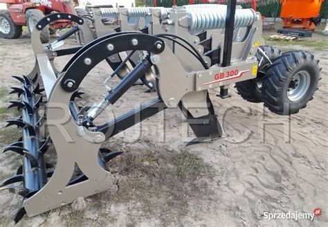 Porównanie konstrukcji zębów głębosza: warianty z zabezpieczeniem kołkowym, sprężynowym i hydraulicznym