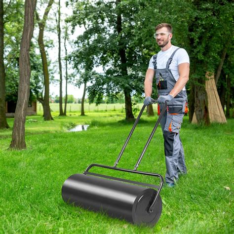 Thematic photo of a person using a petrol lawn roller on a lawn