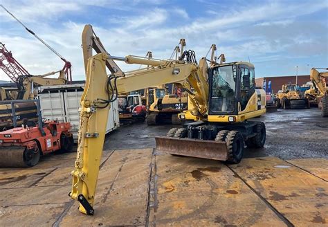 Thematic photo of a Komatsu PW160 excavator working
