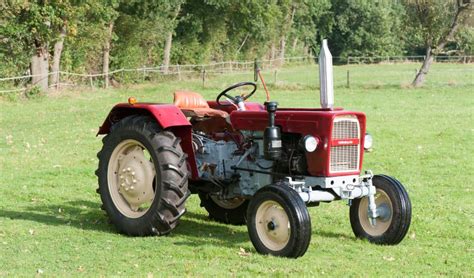 Thematic photo of Ursus C330 tractor with a rear loader attachment