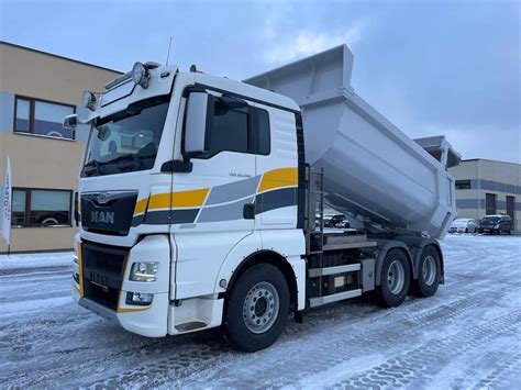 Thematic photo of a MAN TGX 460 tipper working on a construction site