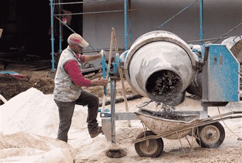 Thematic photo of a construction site with a concrete mixer and concrete pump in action