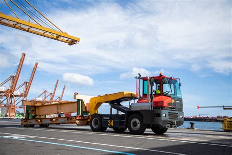 Thematic photo of a Kalmar terminal tractor operating in a port or logistics hub