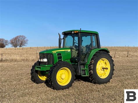 Thematic photo of John Deere 6330 tractor working in a field