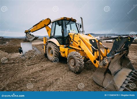 Thematic photo of a Caterpillar backhoe loader working on a construction site