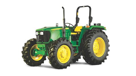 The John Deere 5075E tractor in an agricultural setting
