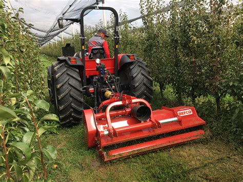 Photo of Agromehanika VM 180H flail mower in an orchard
