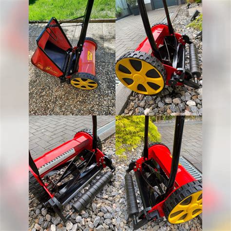 Zdjęcie kosiarki bębnowej Wolf Garten TT300S z bliska, pokazujące bęben tnący i szerokość roboczą.